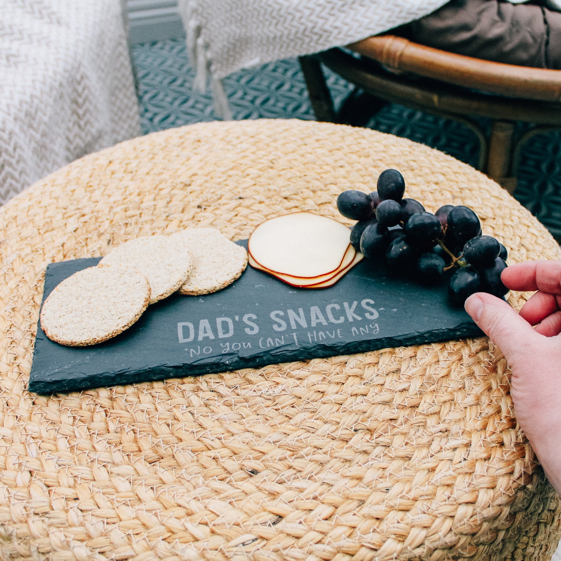 Engraved slate serving board featuring a playful inscription "Dad's Snacks No You Can't Have Any" - a fun way for Dad to showcase his cheese collection (with a clear warning!).