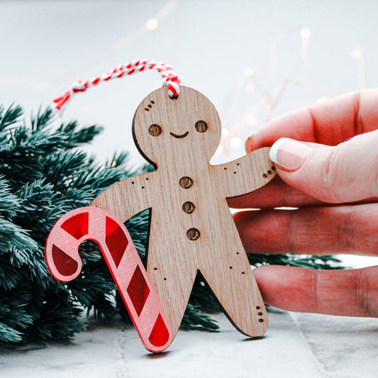 wooden Gingerbread man Christmas tree decoration with candy cane stick