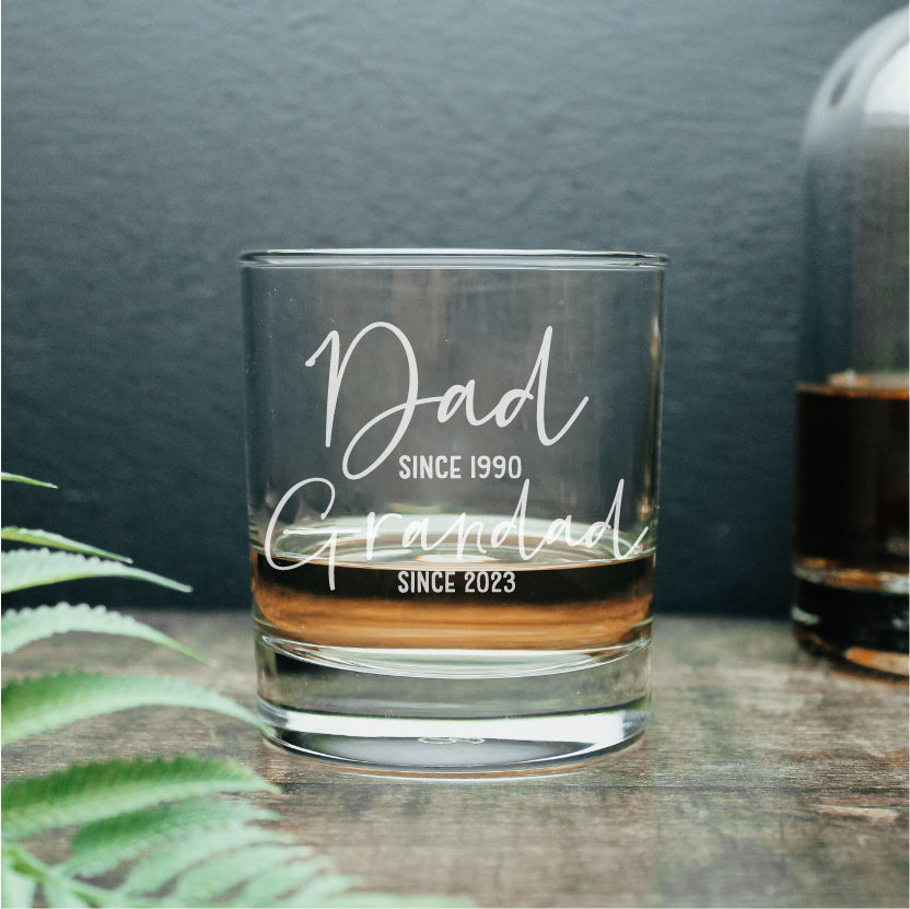 whisky glass tumbler personalised with the wording dad since 1990 and grandad since 2023 engraved on it. Ideal gift for new grandad