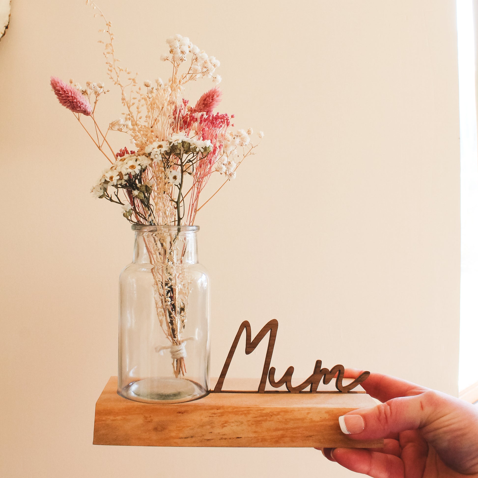 Personalised wooden vase holder made from Scottish elm with a live edge, featuring a 3D name cutout like Mum or Granny – a unique gift for Mother’s Day
