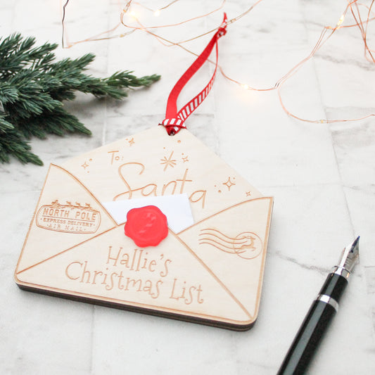 wooden envelope personalised with a name for putting in your letter to santa and hanging it up on the Christmas tree
