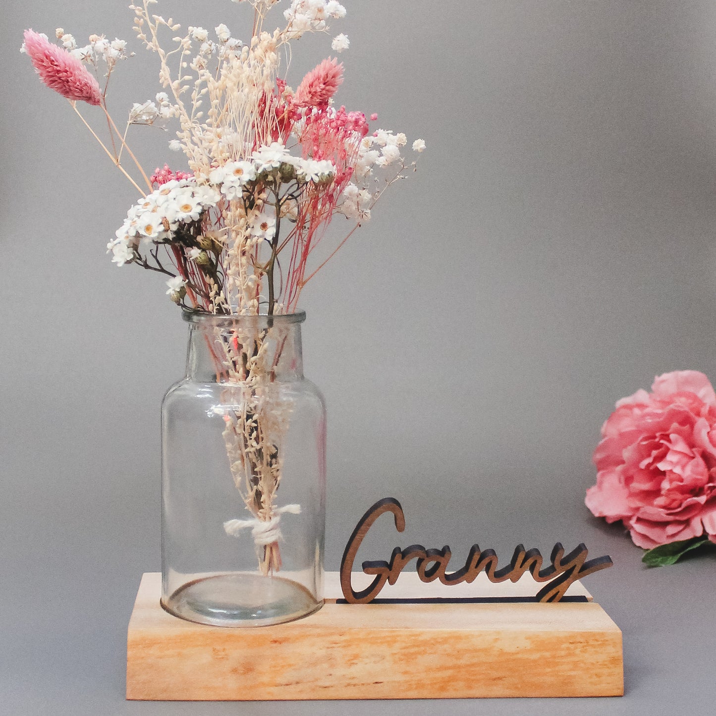 Granny wooden vase holder with a personalised name display – a sentimental gift perfect for showcasing wildflowers or found treasures from children.