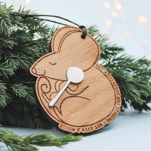 Wooden mouse ornament with a night before christmas quote. Sitting on a Christmas tree branch