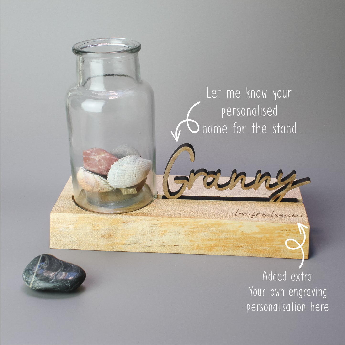 Custom wooden plinth with a personalised 3D name cutout, designed to hold a glass vase for displaying fresh flowers or keepsakes