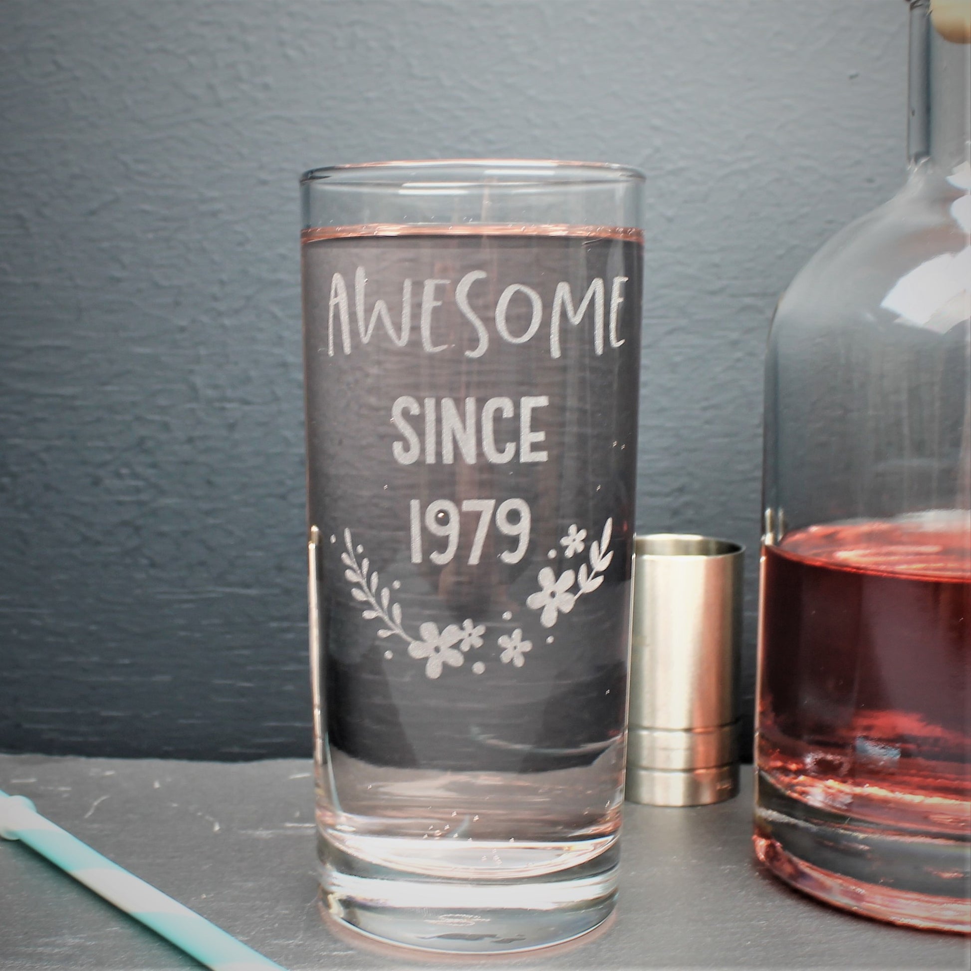 Engraved tall gin glass personalised with birthday year on and flower design