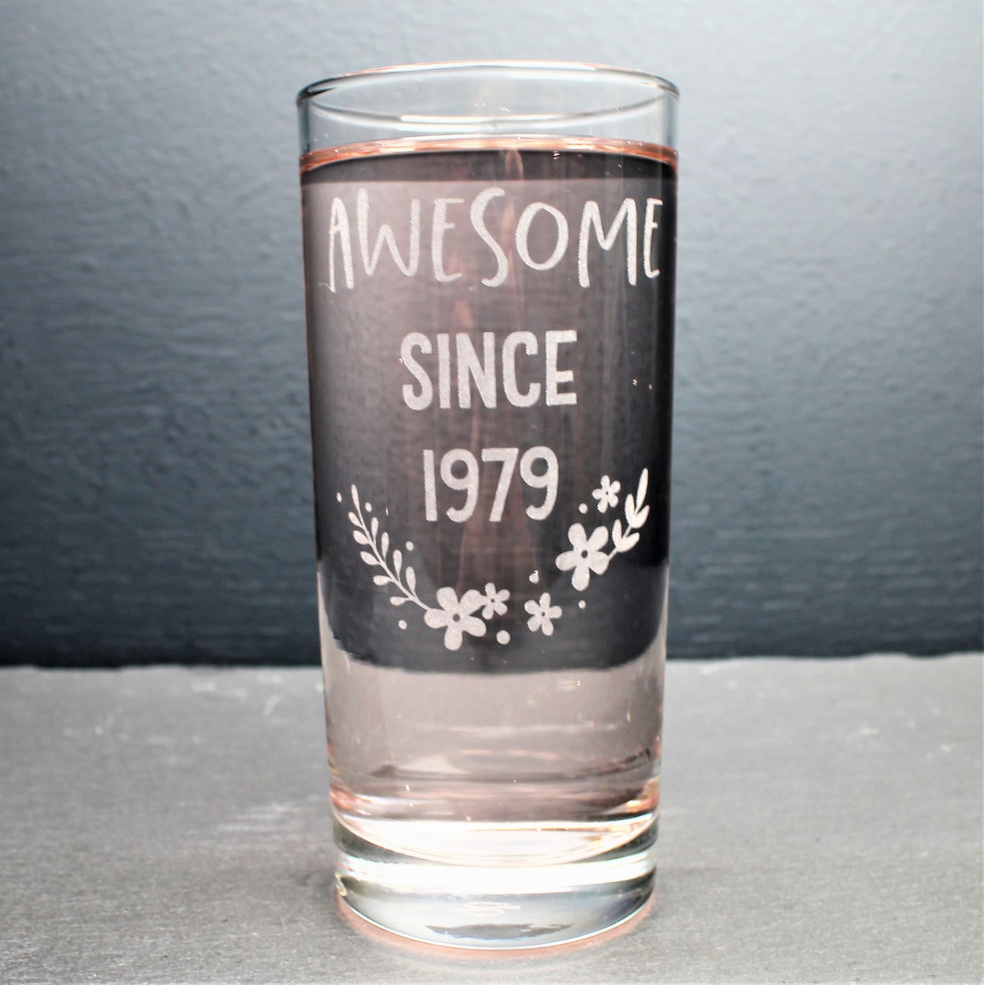 Engraved tall gin glass personalised with birthday year on and flower design
