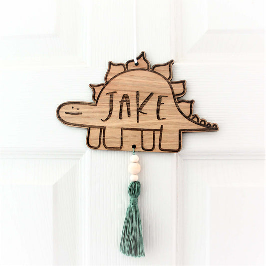 wooden dinosaur personalised sign for kids room with tassel