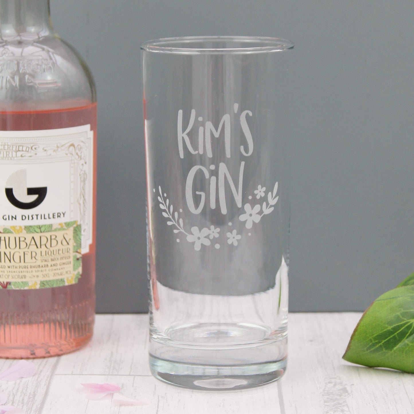 Tall gin glass engraved with the personalised text of your choice, with added floral design elements