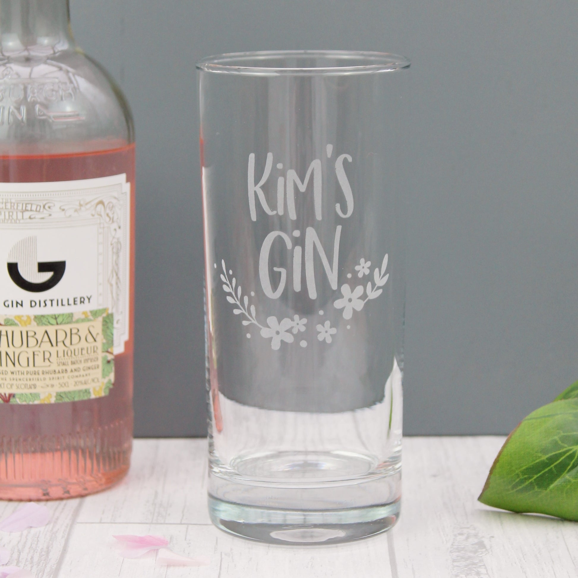 Tall gin glass engraved with the personalised text of your choice, with added floral design elements