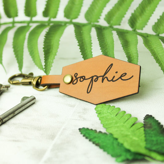 personalised name keyring engraved on a whisky coloured brown leather affixed to a swivel clasp