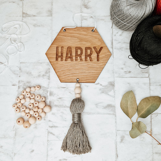 hexagon shaped wooden name sign for kids bedroom decor with coloured tassel
