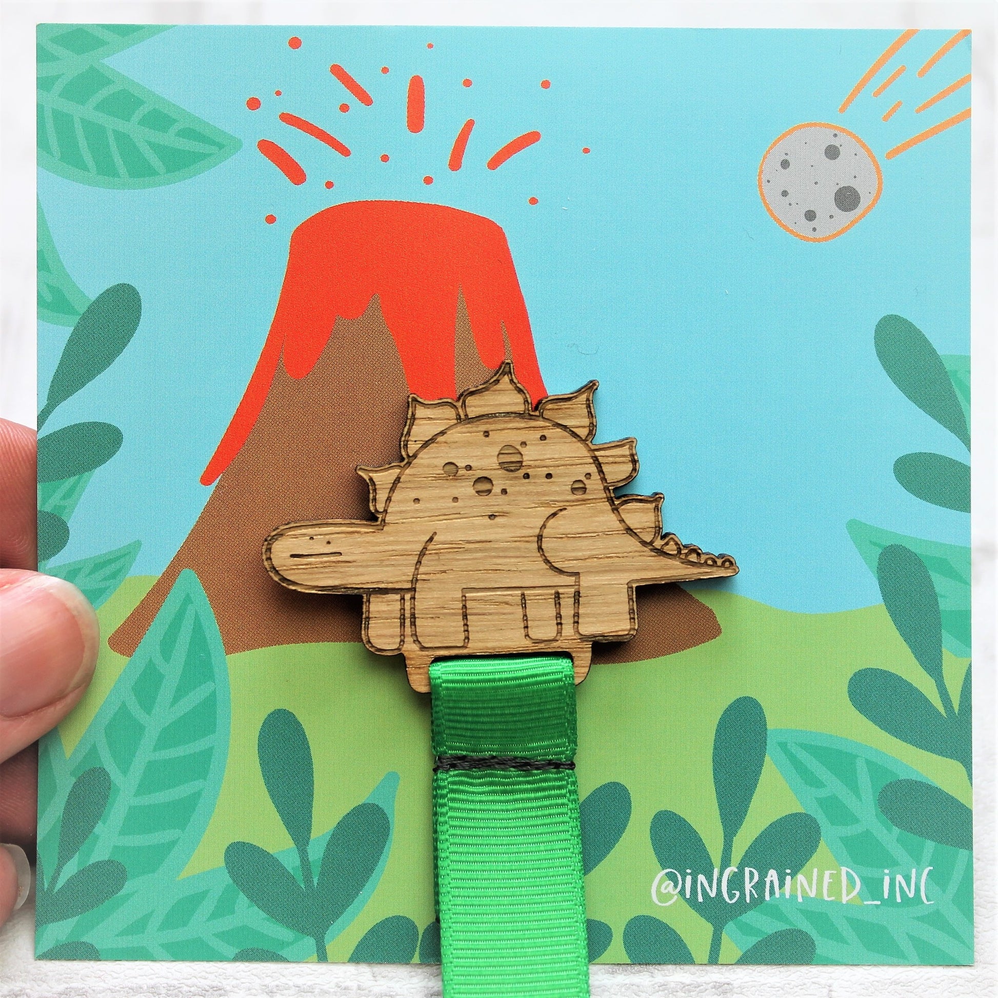 wooden dinosaur bookmark for child with green ribbon