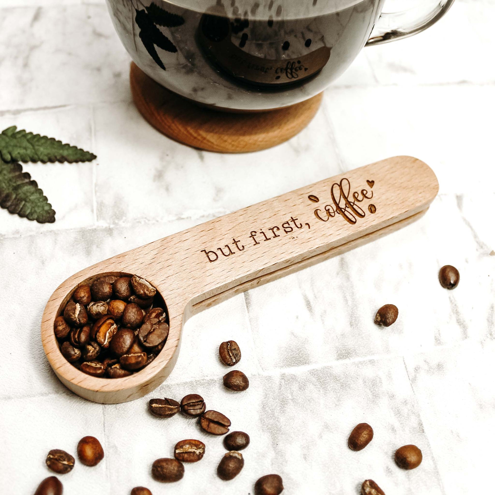 wooden coffee scoop and clip engraved with coffee quote