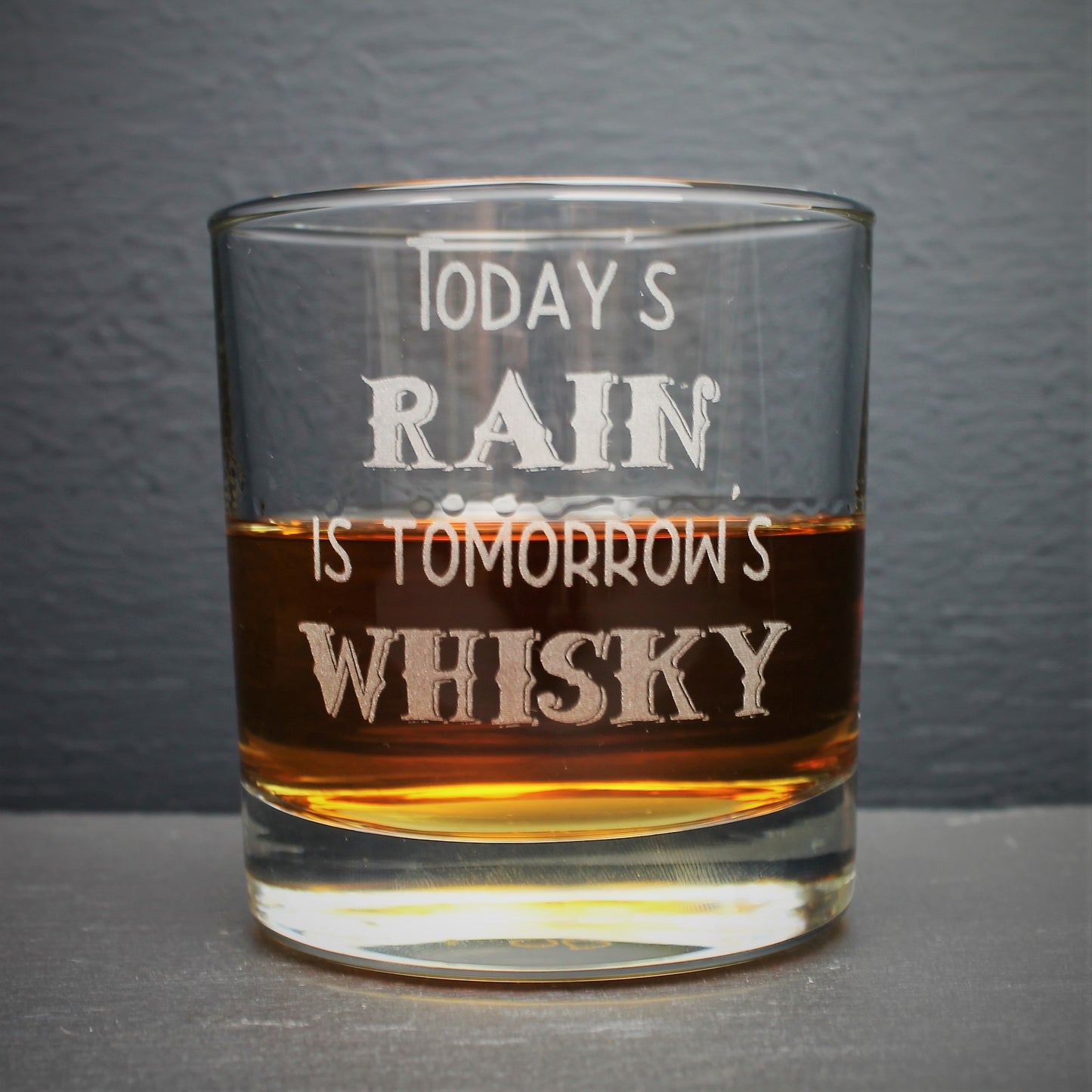 Engraved whisky glass etched with the Scottish quote, todays rain is tomorrows whisky