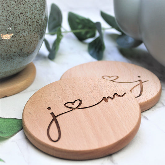 wooden couple coasters engraved with initials