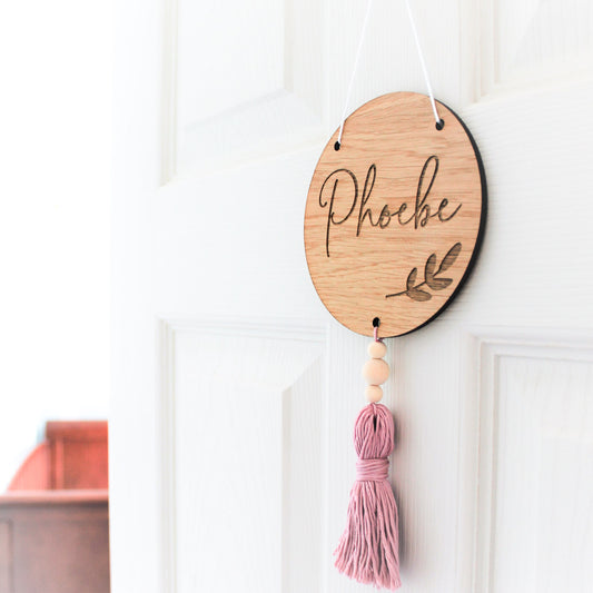 Wooden round nursery sign with botanical leaf design