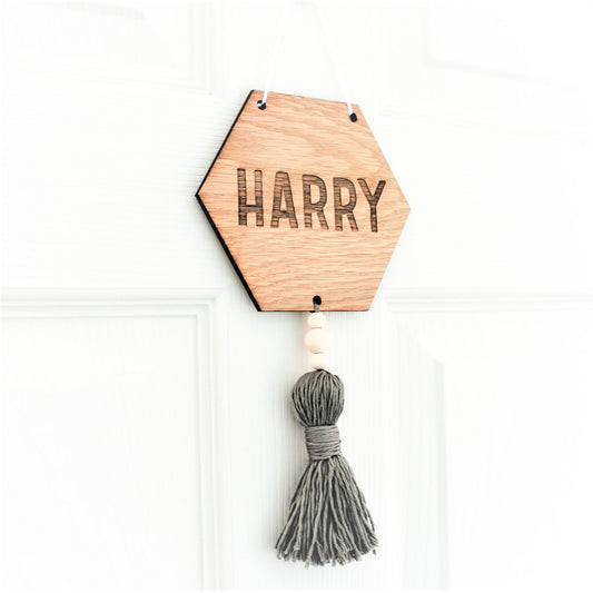 wooden hexagonal door sign for nursery, engarved with name or word of choice with coloured tassel