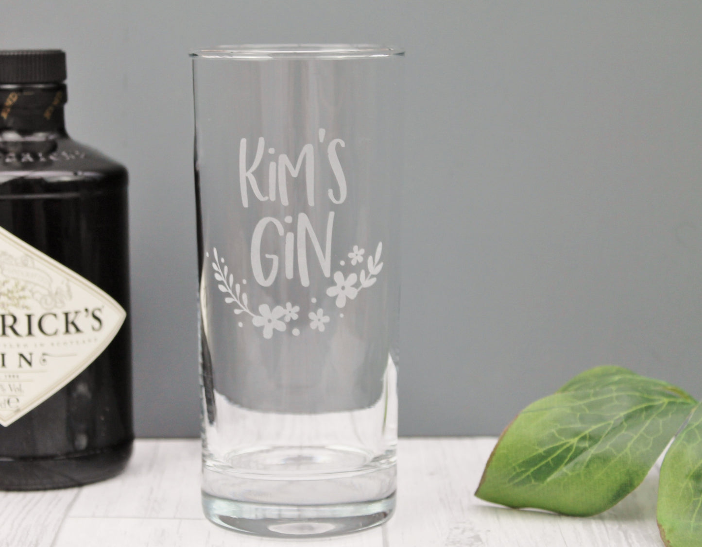 personalised tall gin glass with floral design. Engraved with the name of your choice