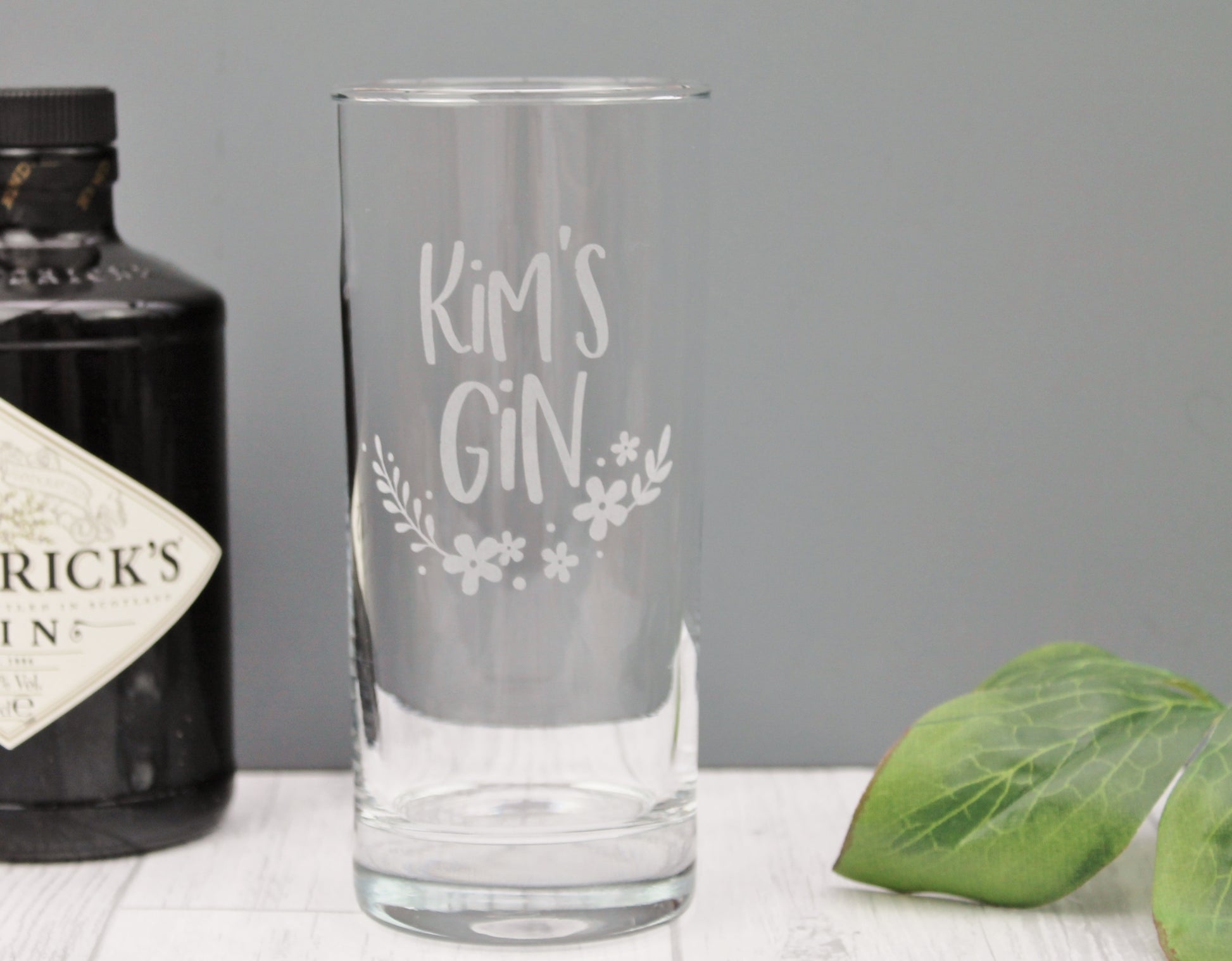 personalised tall gin glass with floral design. Engraved with the name of your choice