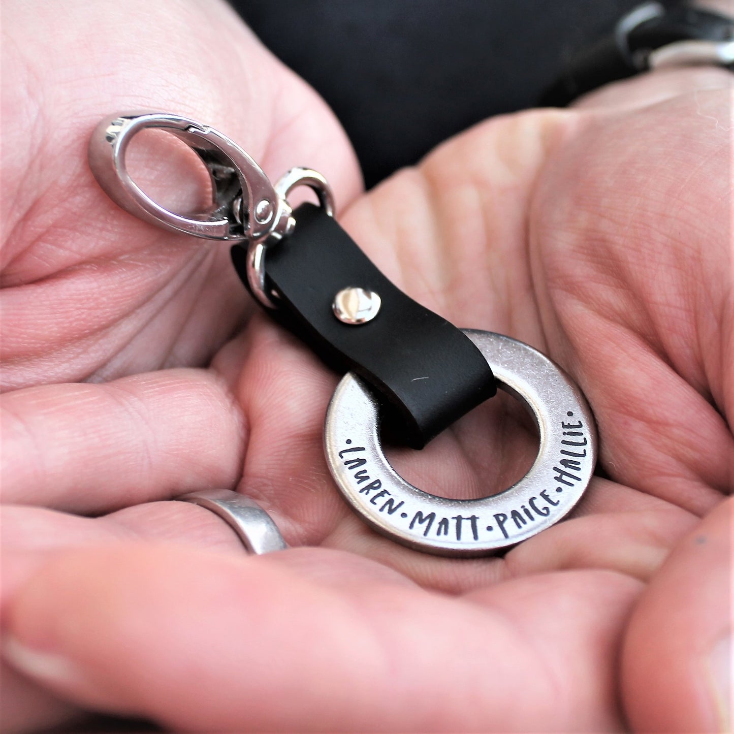 Family names engraved on metal and leather keyring