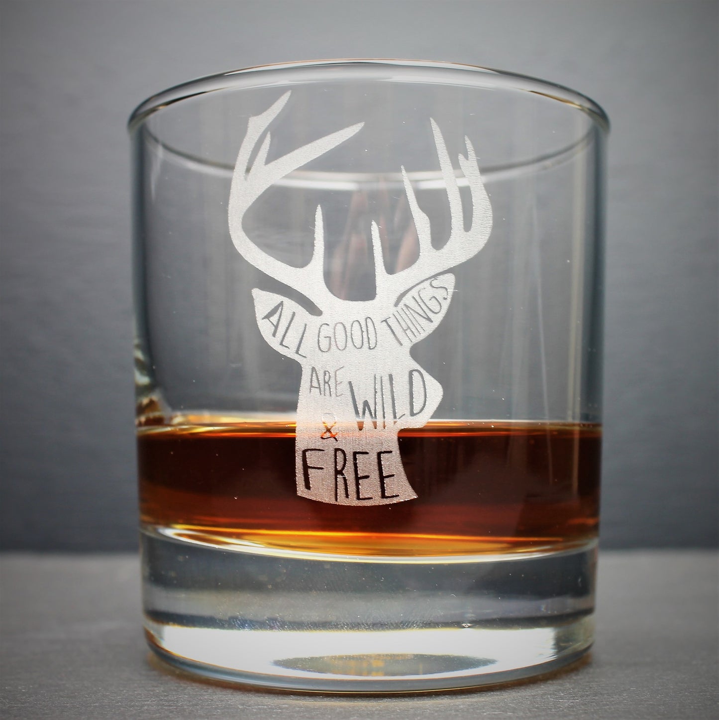 Engraved whisky tumbler glass with stag design and quote