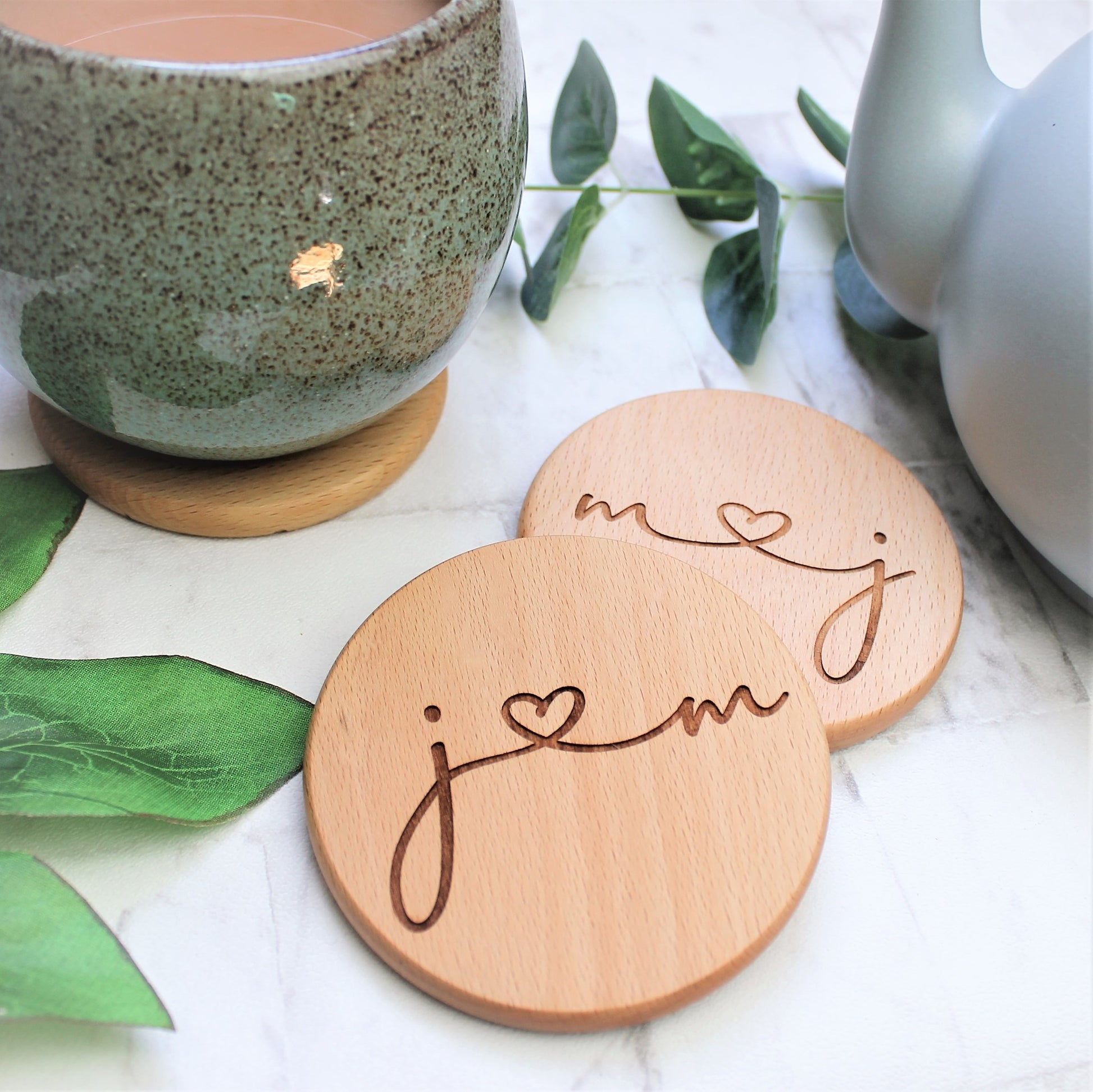 wooden coaster engraved with couples initials