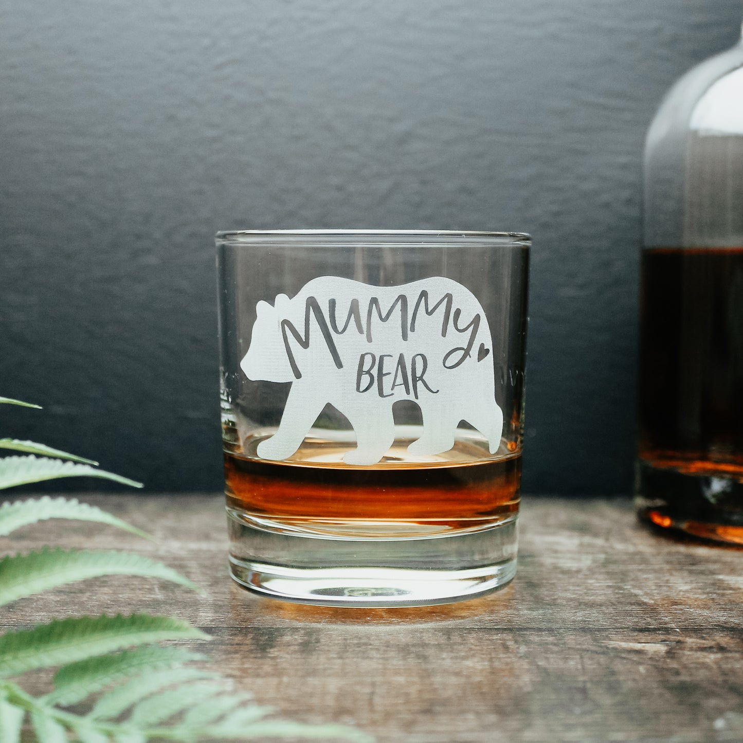 whisky glass for mum engraved with a bear design and has the words mummy bear written inside the bear