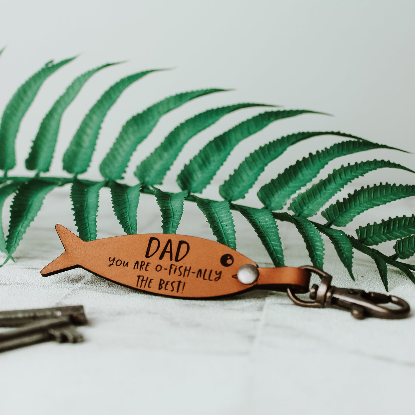 whisky leather keyring in a fish shape personalised with your own text