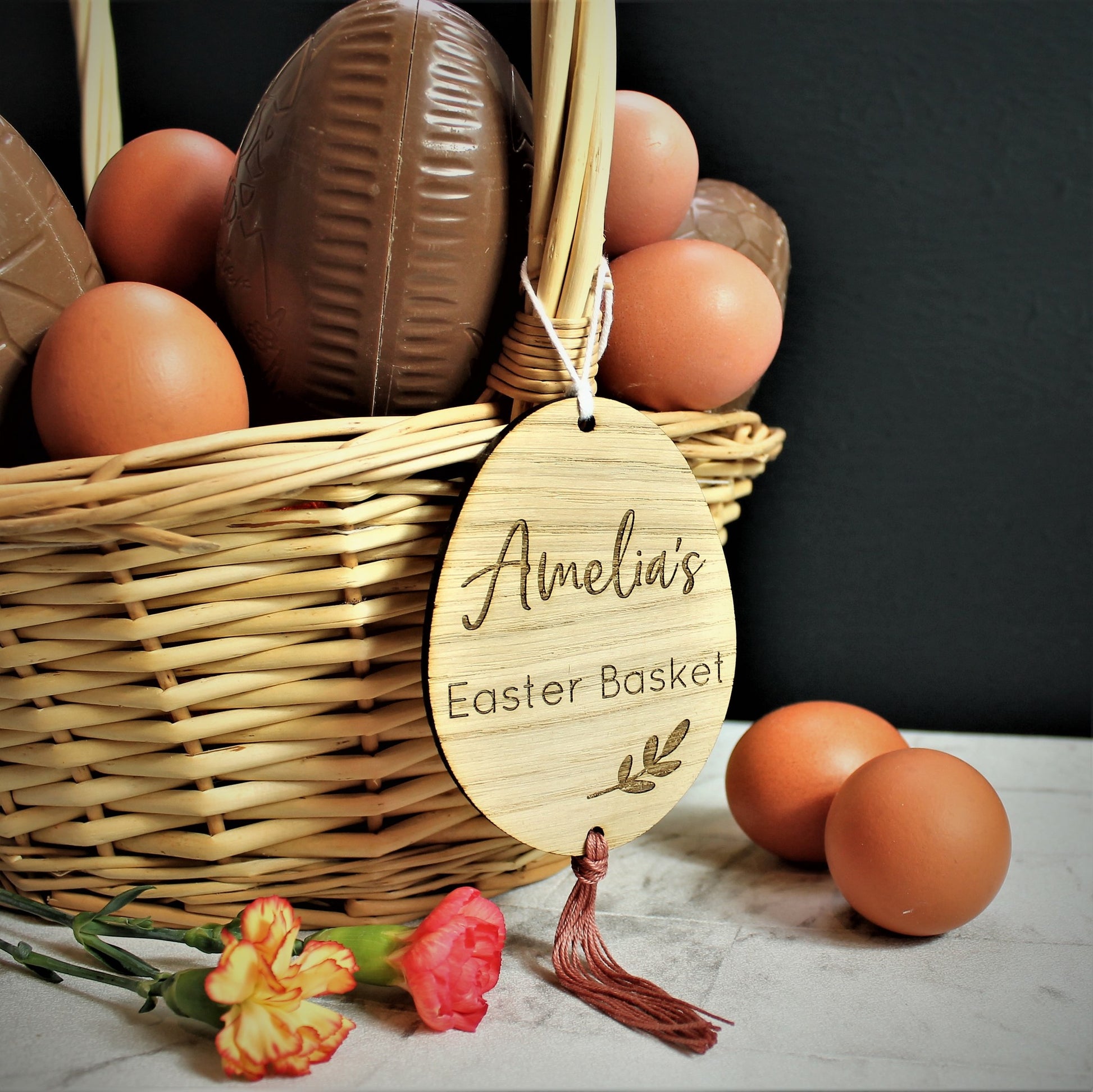 wooden engraved egg shaped tag for easter basket. Personalised with name