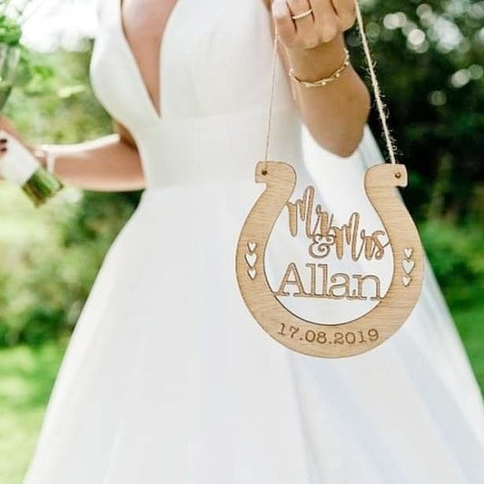 Wooden personalised horseshoe traditional wedding gift for bride and groom. Customised with wedding date and couples name
