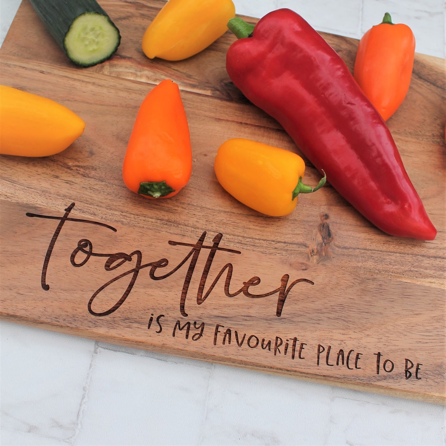 Wooden serving board engraved with the phrase together is my favourite place to be