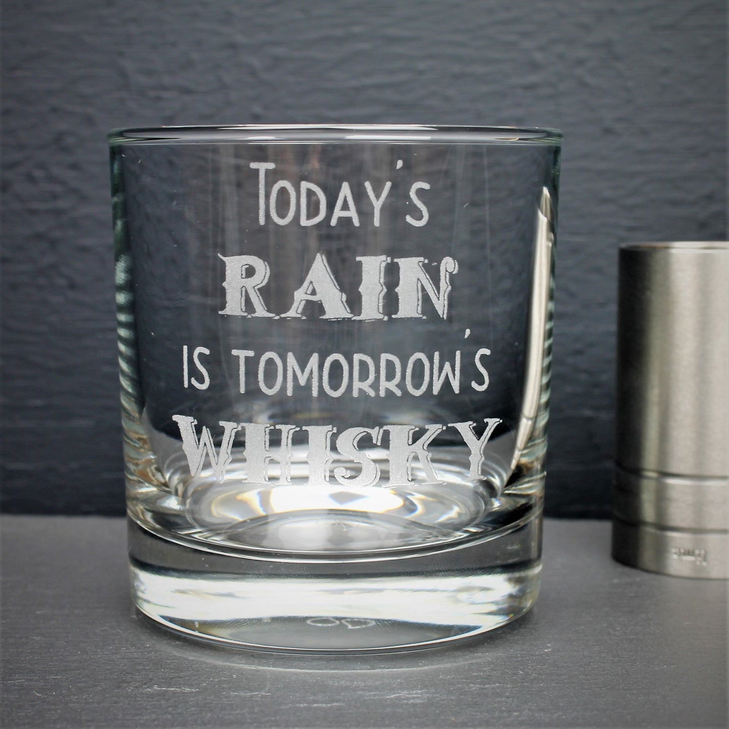 Engraved whisky glass etched with the Scottish quote, todays rain is tomorrows whisky