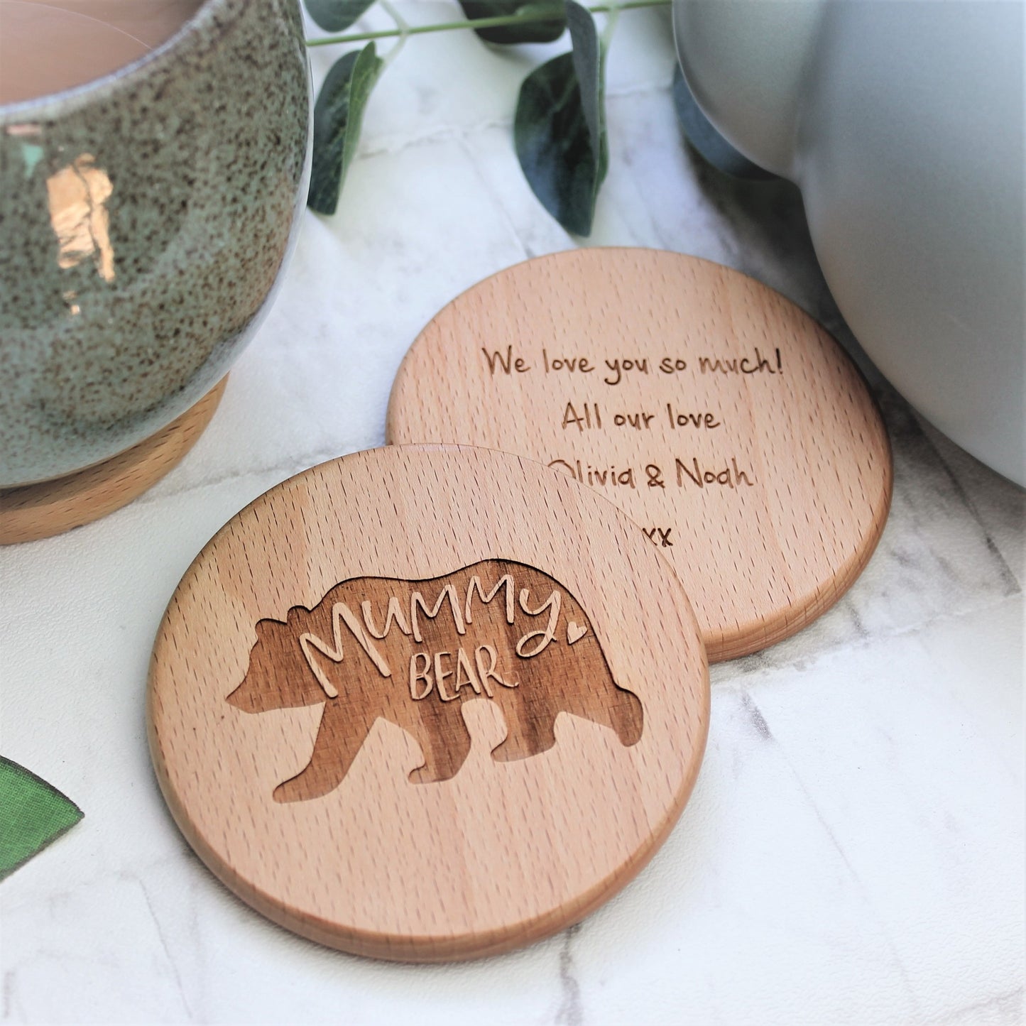 round wooden coaster engraved with mummy bear and bear design