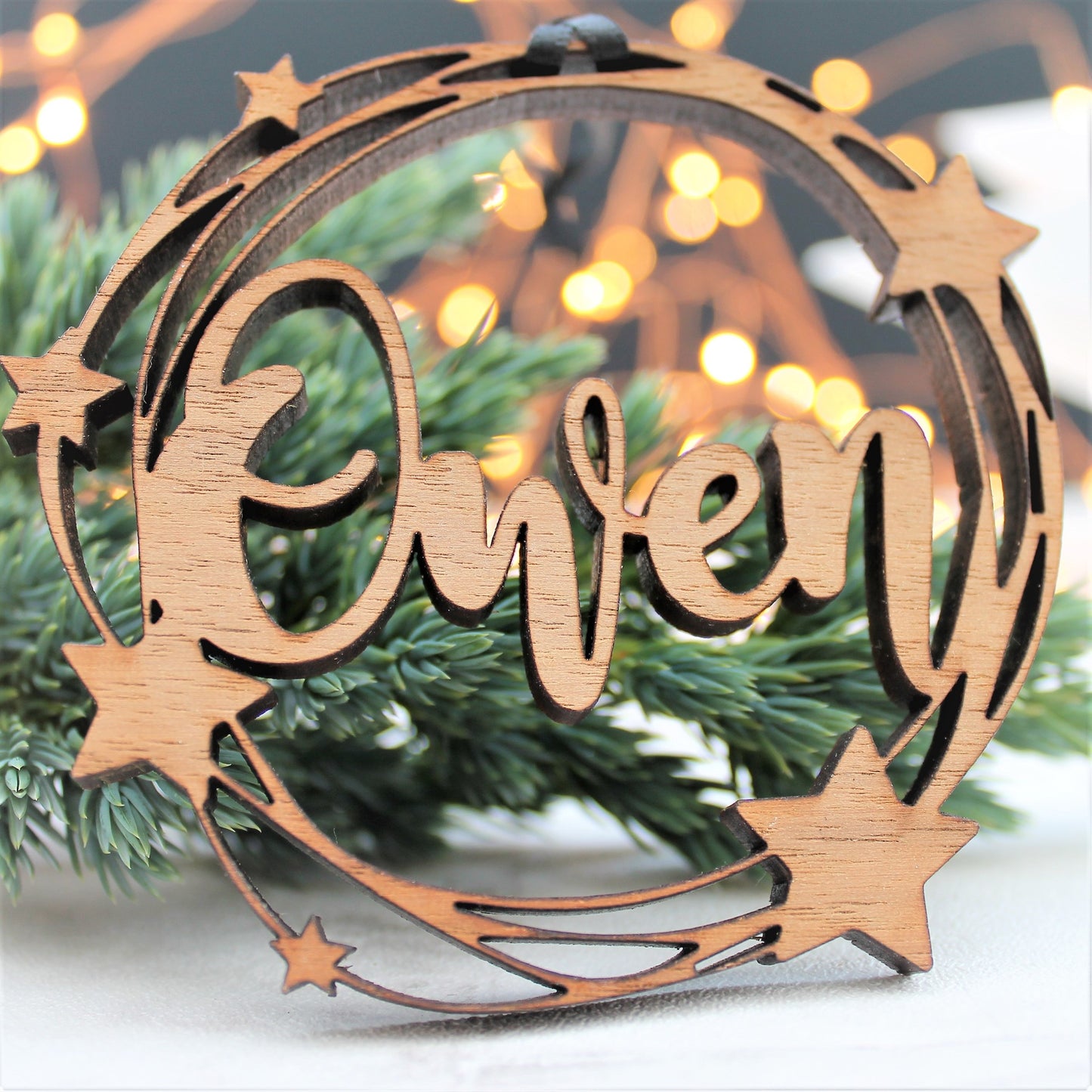 Wooden bauble with star design, personalised with a name, laser cut
