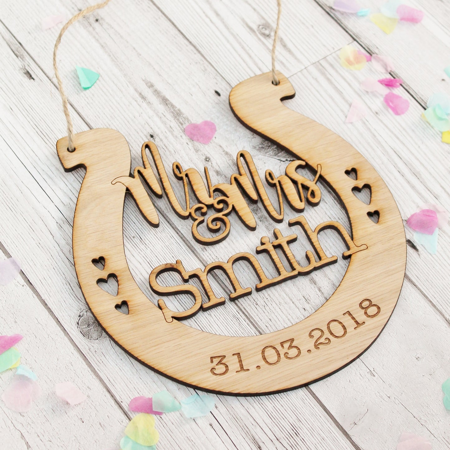 Engraved wooden horseshoe for wedding. Personalised for the bride and groom