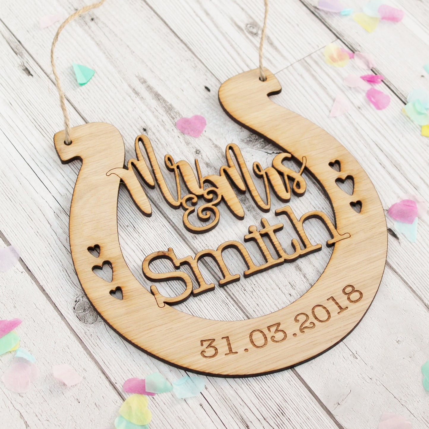 Engraved wooden horseshoe for wedding. Personalised for the bride and groom 