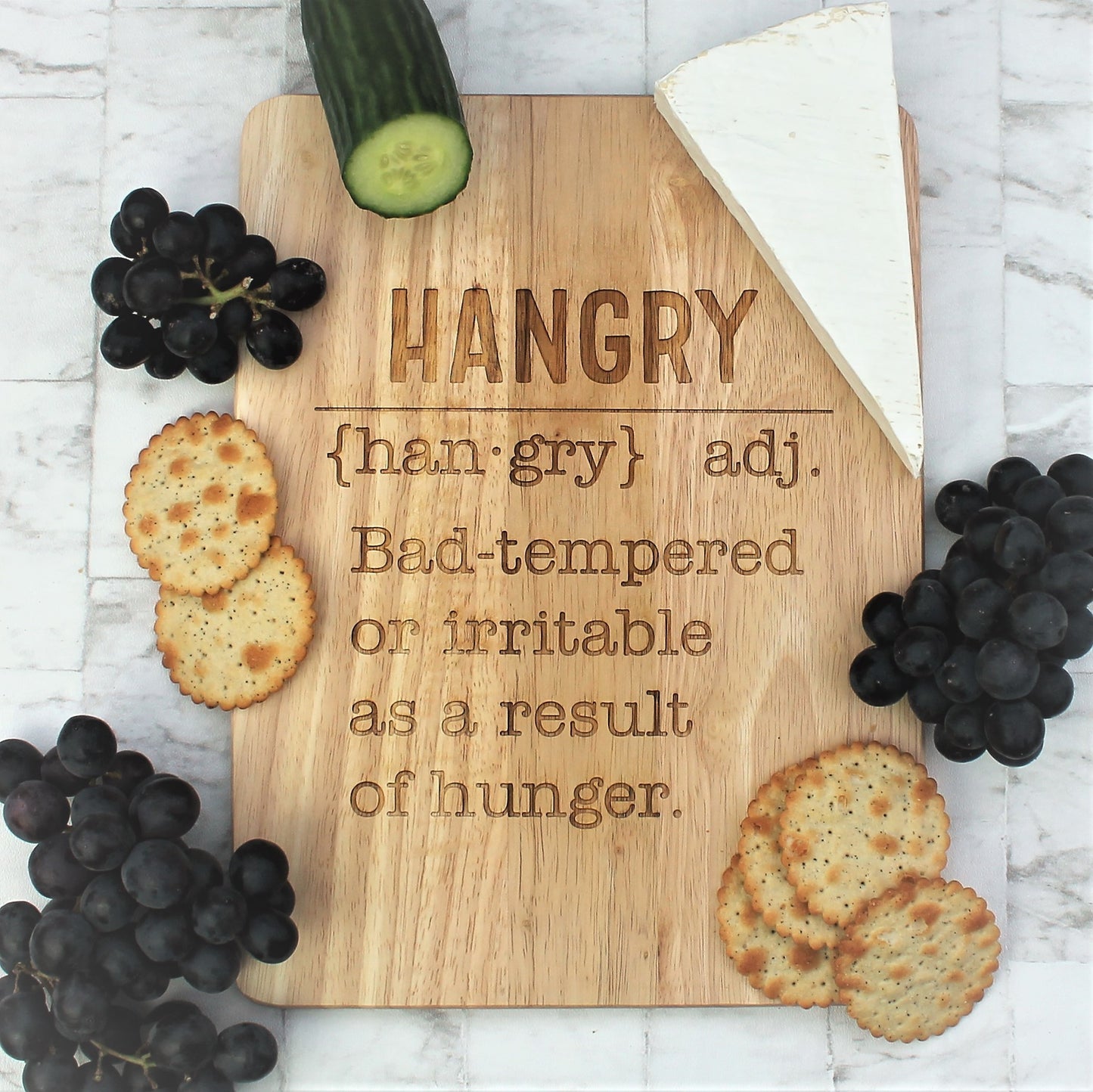 Wooden engraved chopping board with the definition of hangry etched into  it