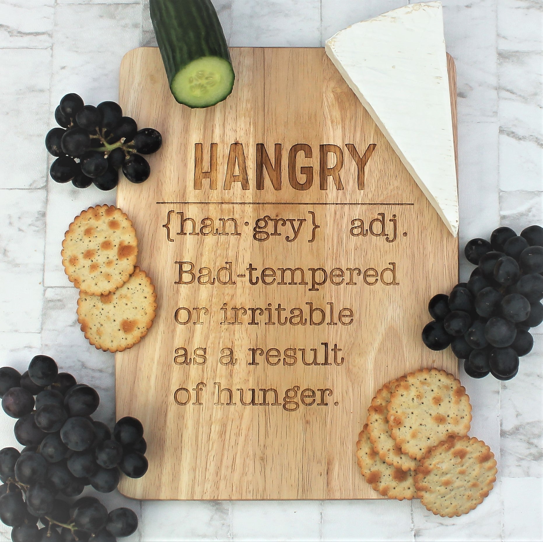 Wooden engraved chopping board with the definition of hangry etched into  it