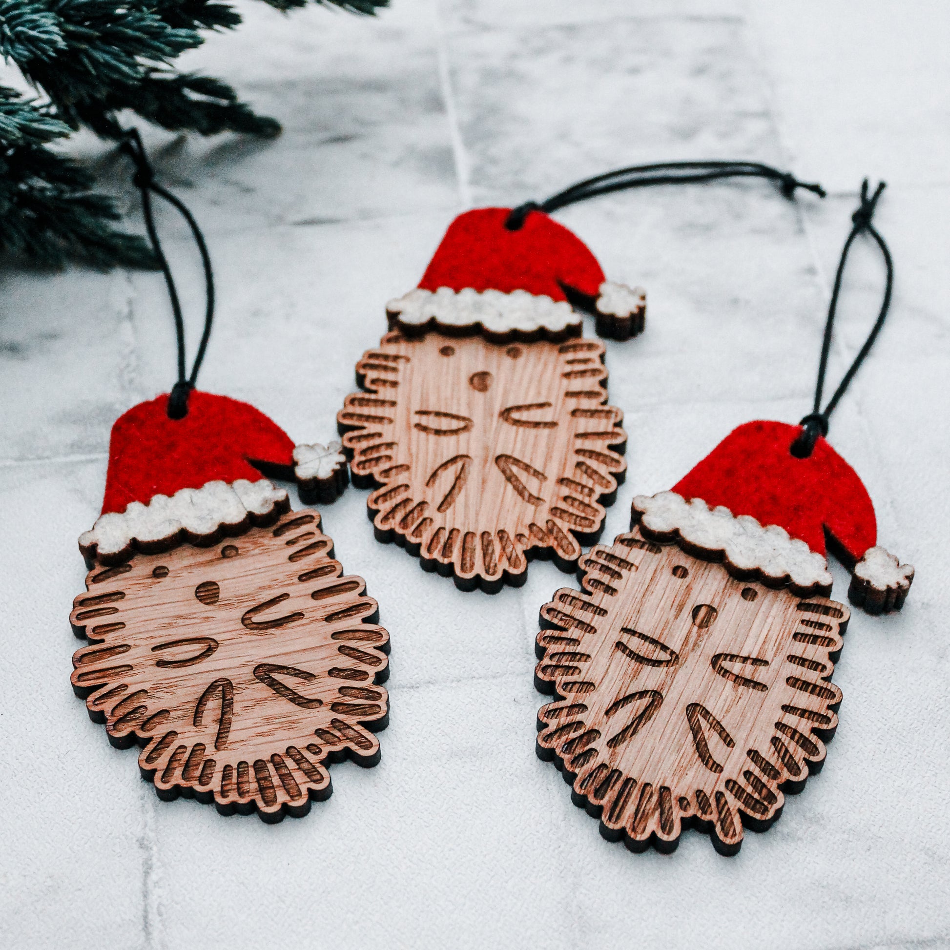image of 3 Wooden hedgehog Christmas tree decorations in felt Santa hats 