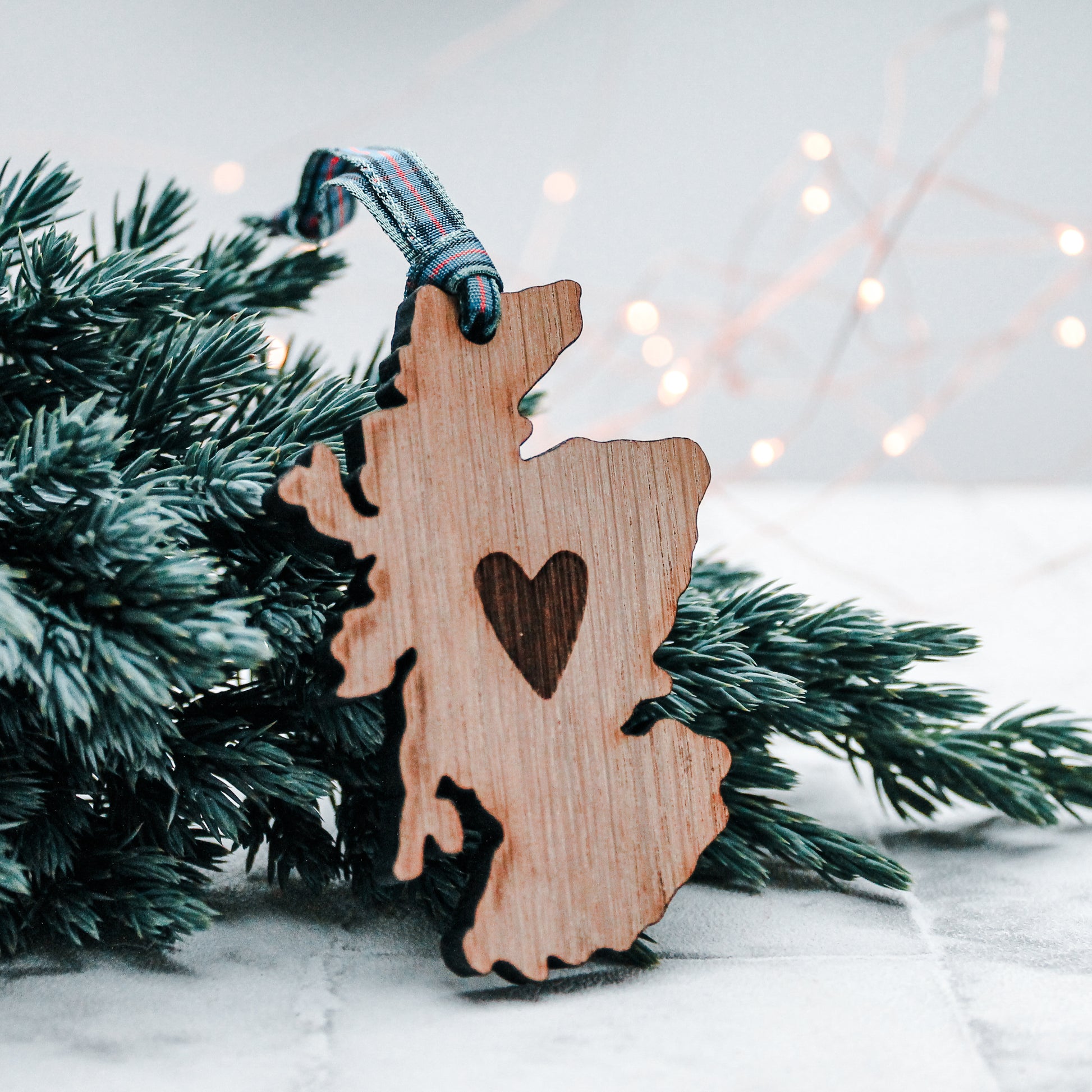 wooden Scotland with engraved heart Christmas decoration with a tartan ribbon 