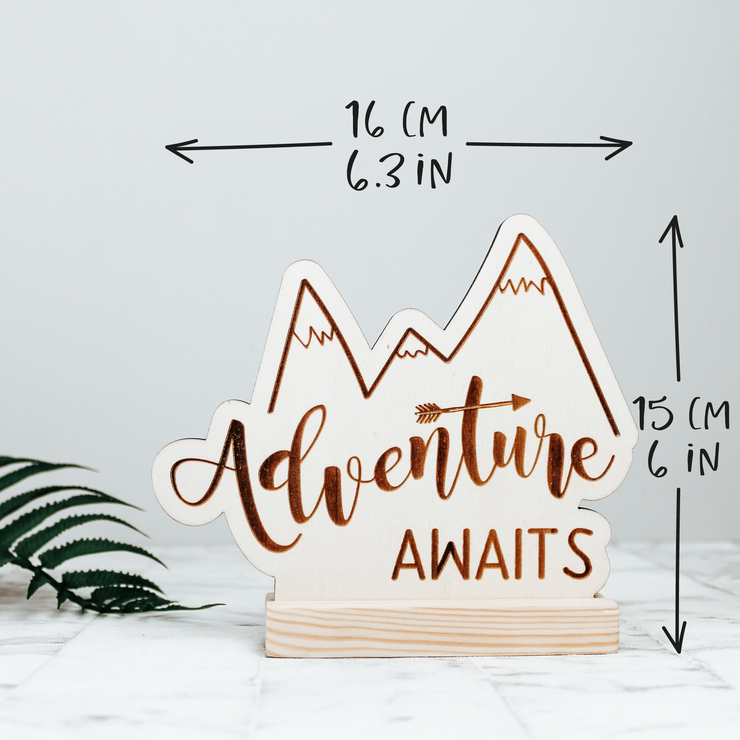 neutral colour wooden adventure awaits sign with added measurements 16cm long and 15 cm high