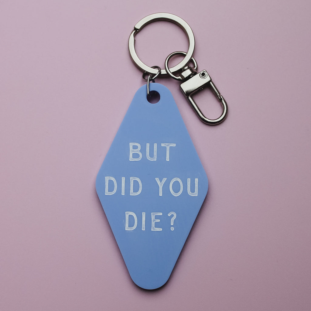 Blue Motel style  keychain tag with 'BUT DID YOU DIE?' text on a pink background