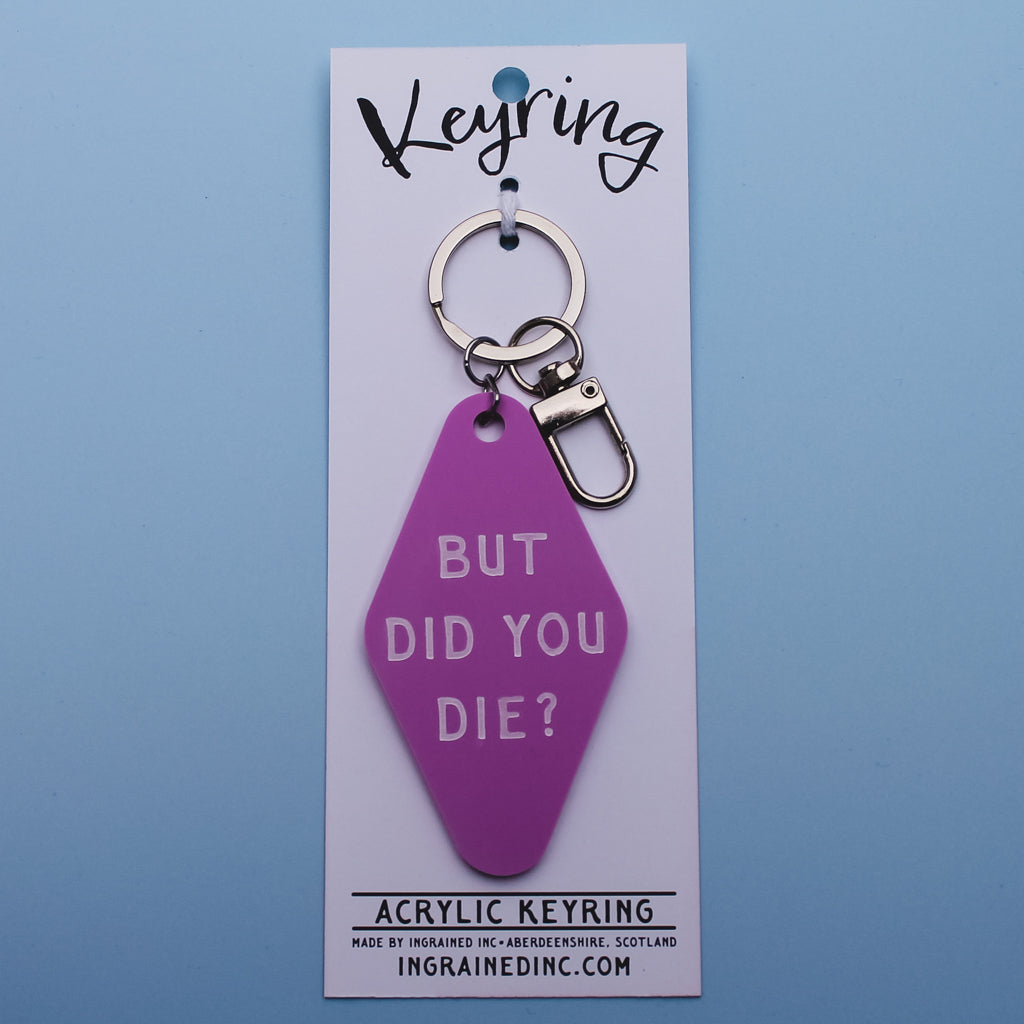 Pink Motel style keychain with 'But did you die?' text on a white backing card against a blue background