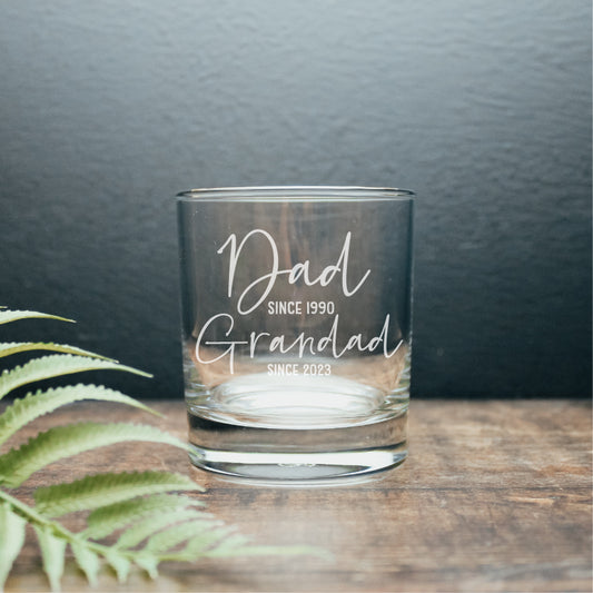 image of a personalised whisky glass with the wording dad since 1990 and Grandad since 2023 engraved on it