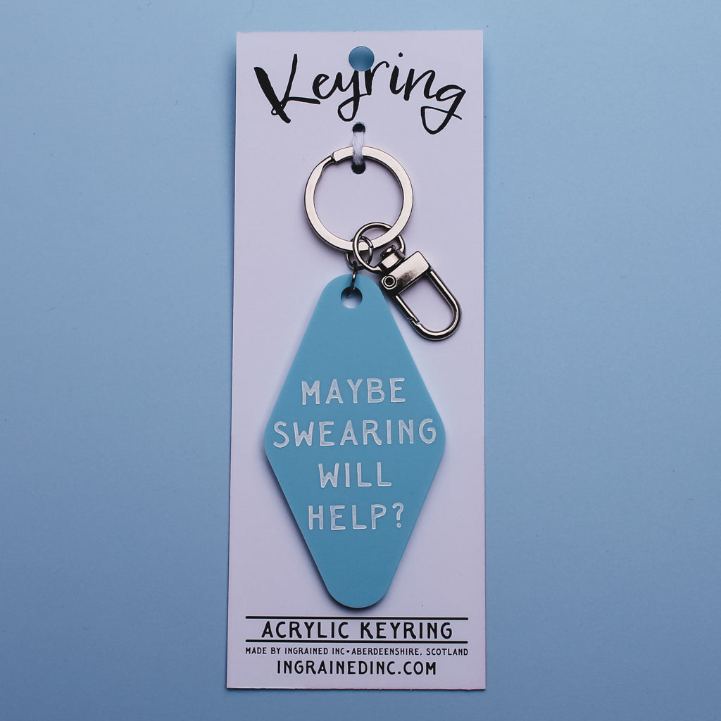 Blue acrylic motel style keyring with on white card packaging against a blue background