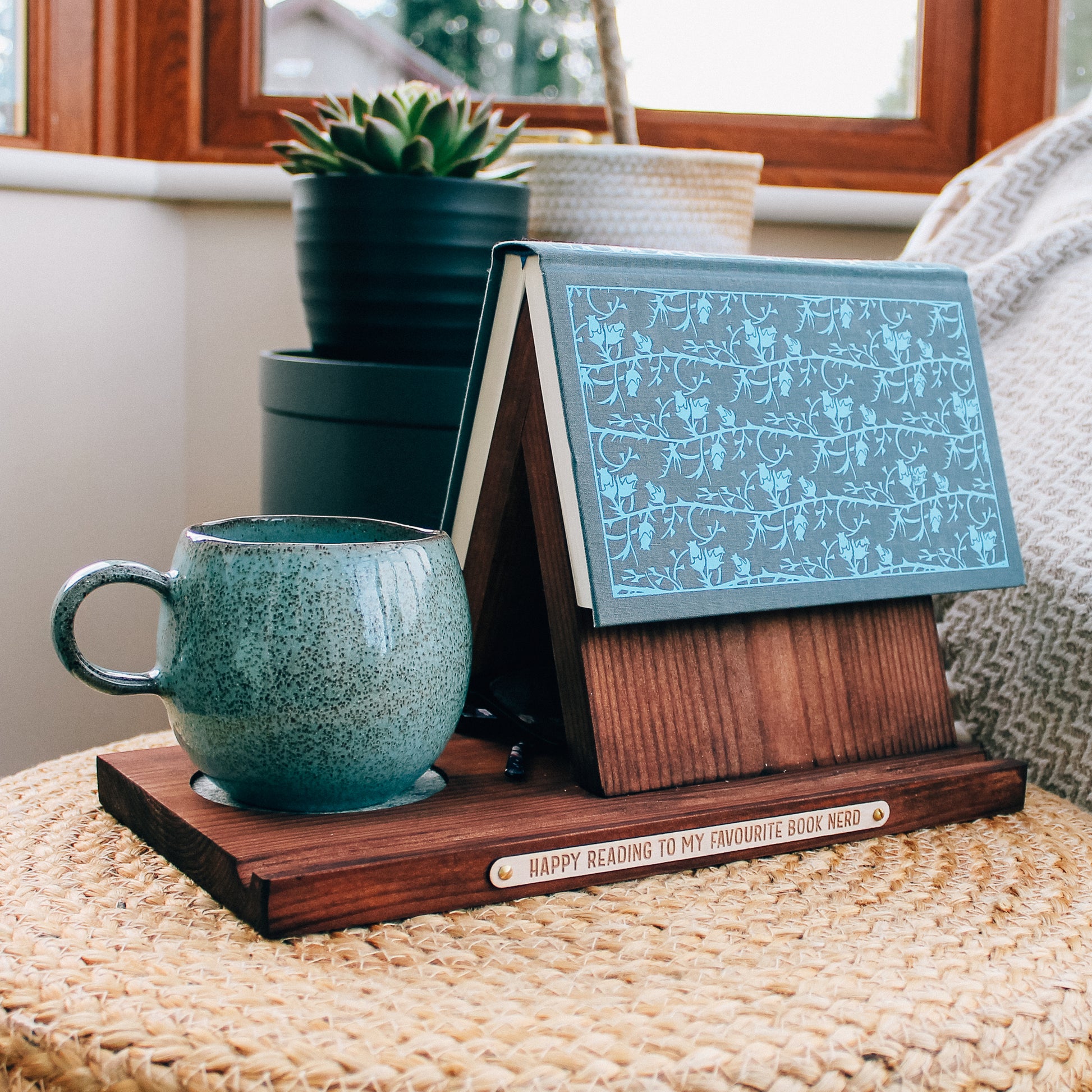 The perfect companion for  the book lover in you life. This personalised dark wooden book valet and a steaming cup of tea.