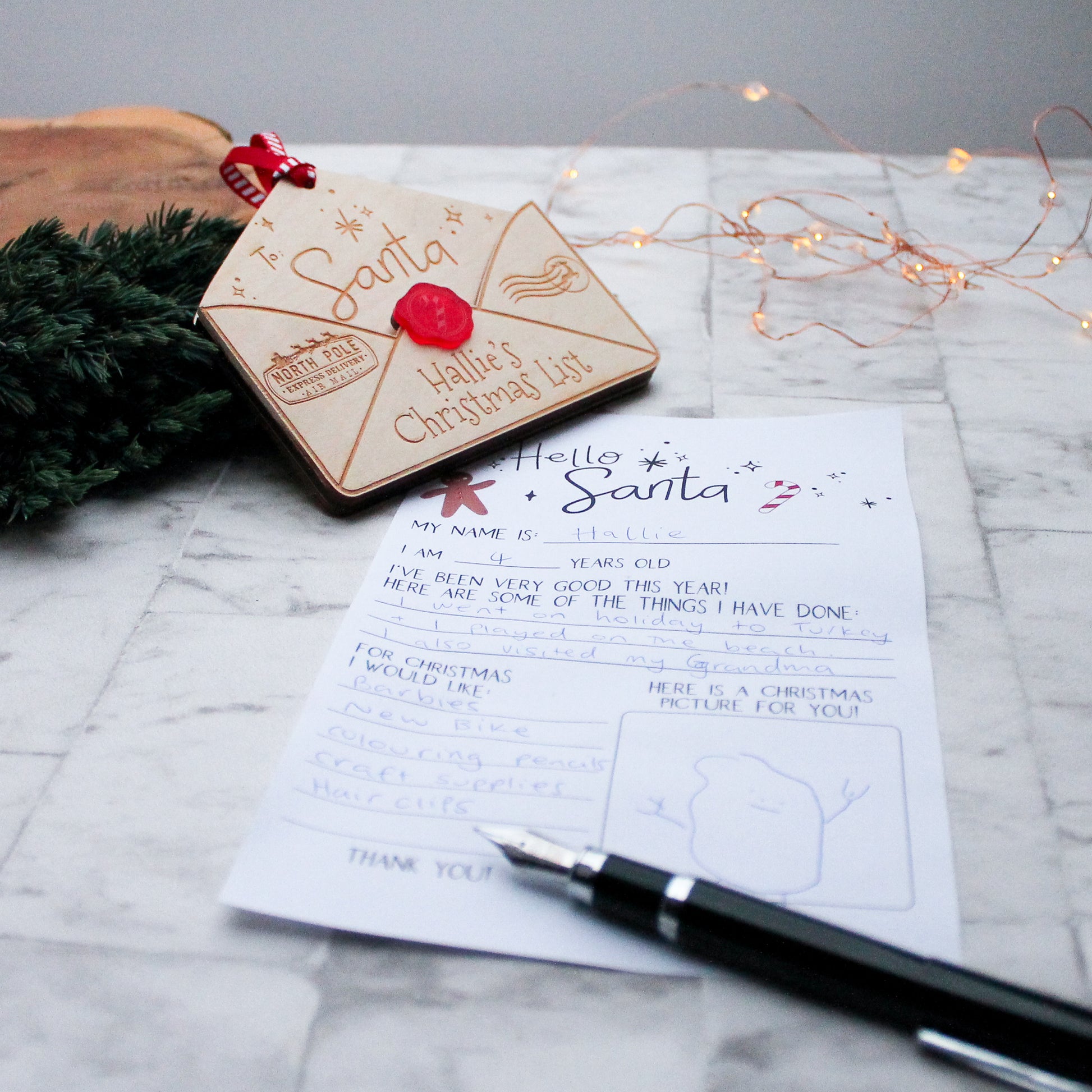 wooden envelope personalised with a name for putting in your letter to Santa in and hanging it up on the Christmas tree 