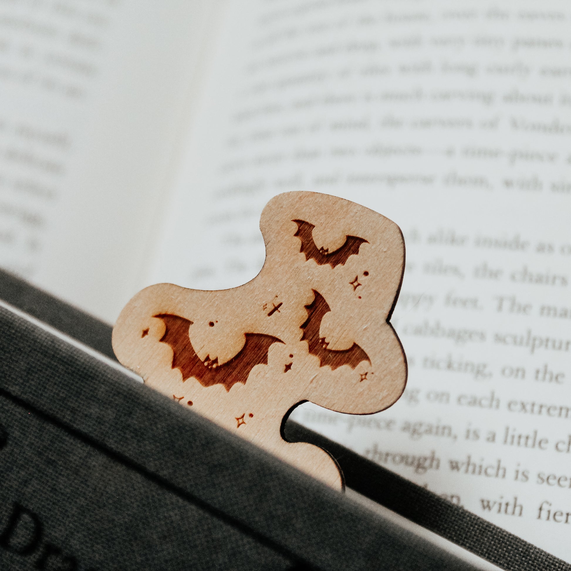 Image showing the bookmark how it appears coming out of a book with bats escaping your book