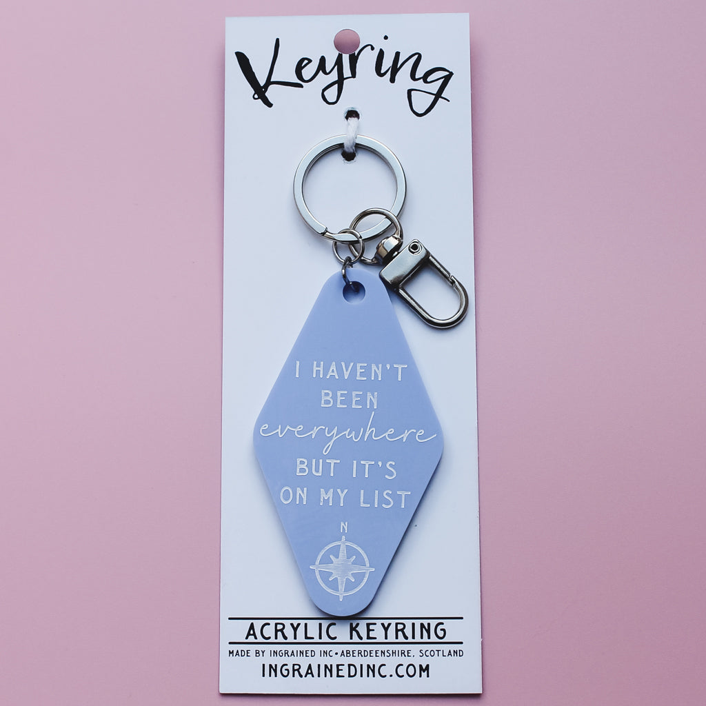 Motel Style Keyring with 'I haven't been everywhere but it's on my list' text on a pink background