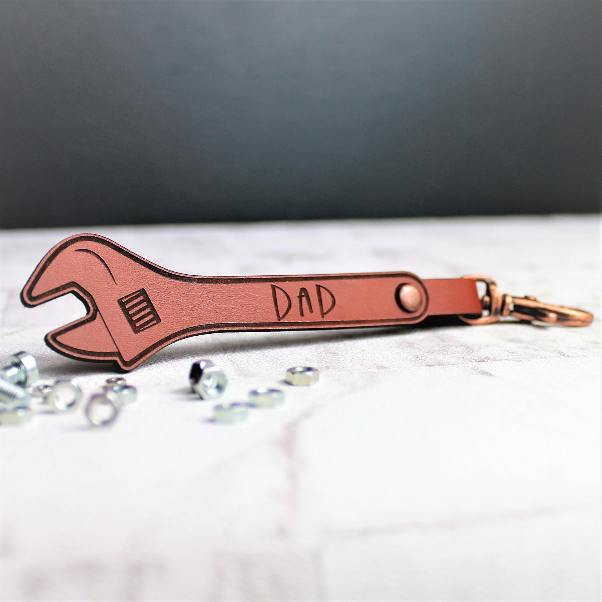 Dad engraved leather keyring in the shape of a plumbers wrench with copper clasp